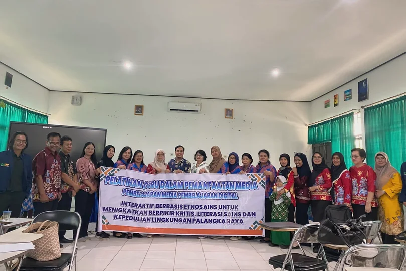 Group photograph in a classroom with a research activity banner.